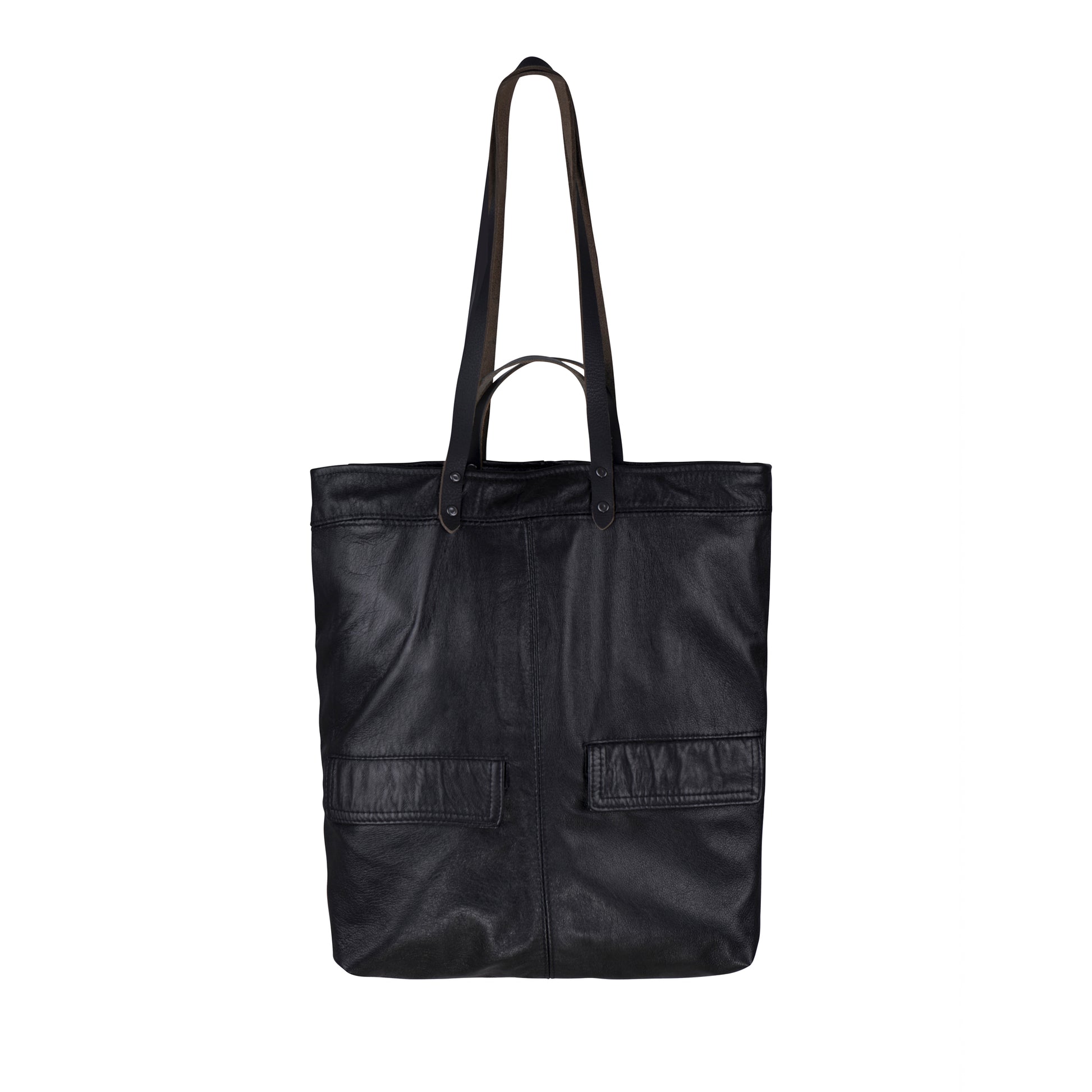 The back of the METANoIA The Cross Bag consisting of recycled leather with an original leather piece wherever possible, every bag has a unique pocket placement.