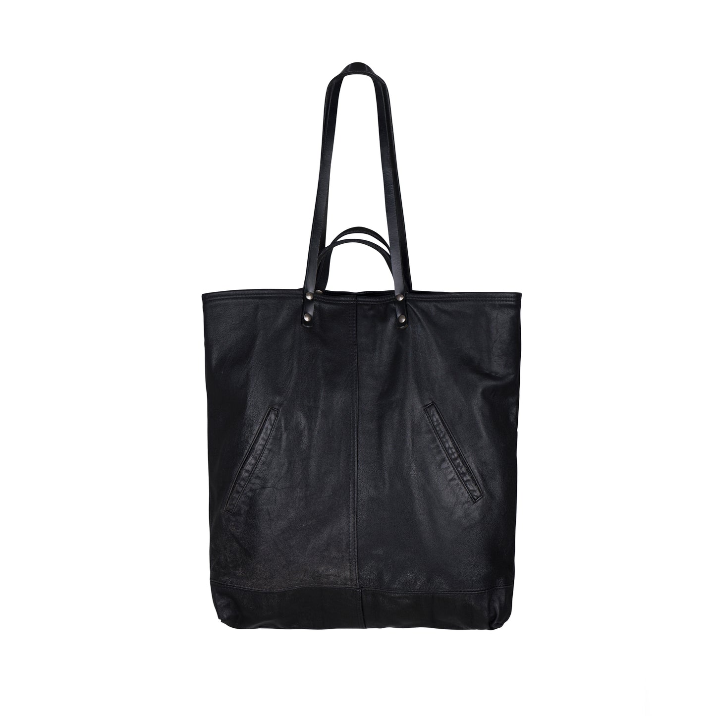 The back of the METANoIA Bag consisting of recycled leather with an original leather piece wherever possible, every bag has a unique pocket placement.