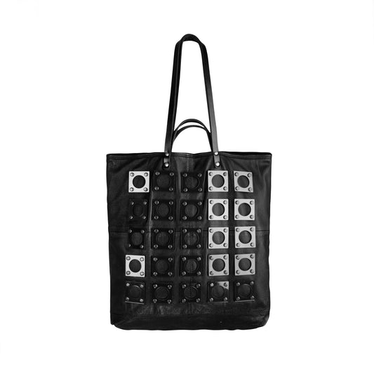 The back of the METANoIA Bag consisting of recycled leather with an original leather piece wherever possible, every bag has a unique pocket placement.