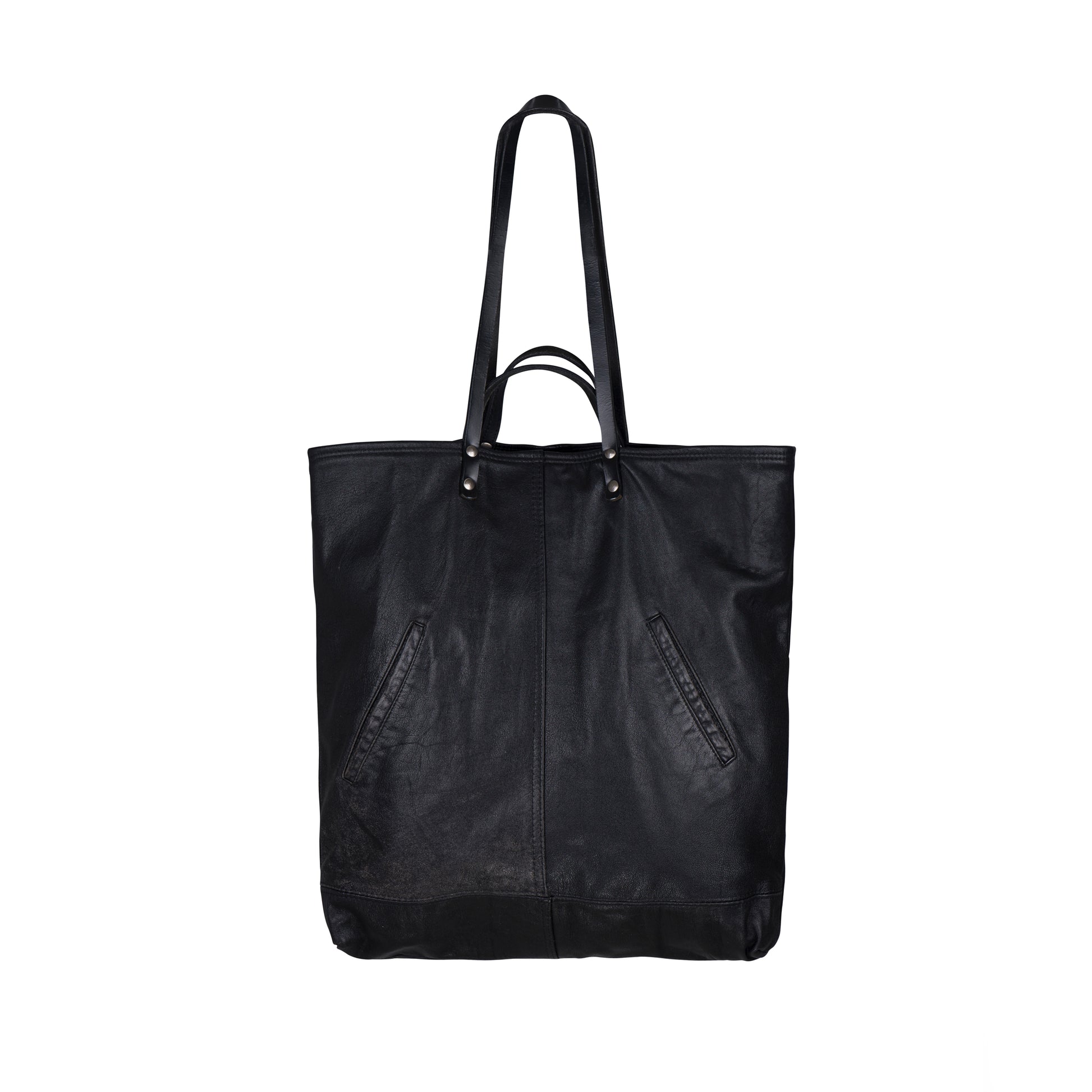 The back of the METANoIA Bag consisting of recycled leather with an original leather piece wherever possible, every bag has a unique pocket placement.