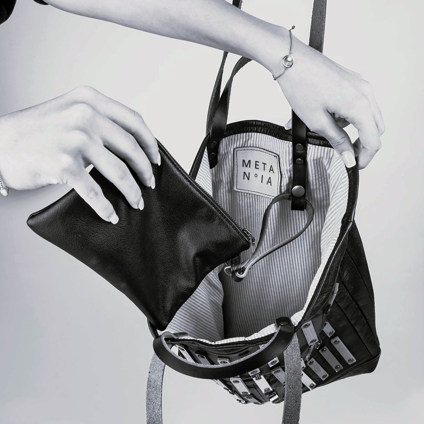 METANoIA Strokes Tote inside featuring pinstripe fabric sourced from recycled fabric and a caramel leather woven label lasered with the iconic METANoIA label.