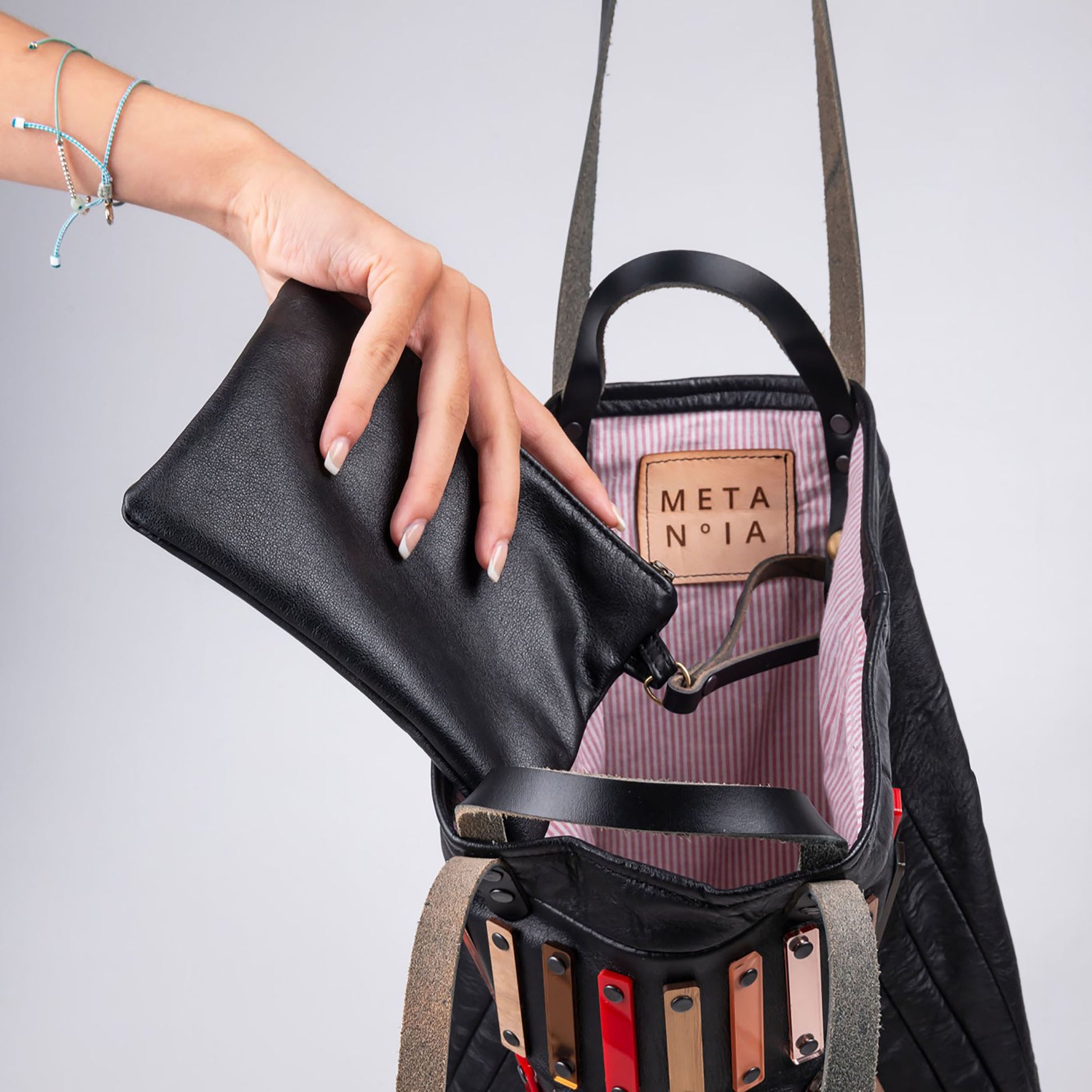 METANoIA Strokes Tote inside featuring pinstripe fabric sourced from recycled fabric and a caramel leather woven label lasered with the iconic METANoIA label.