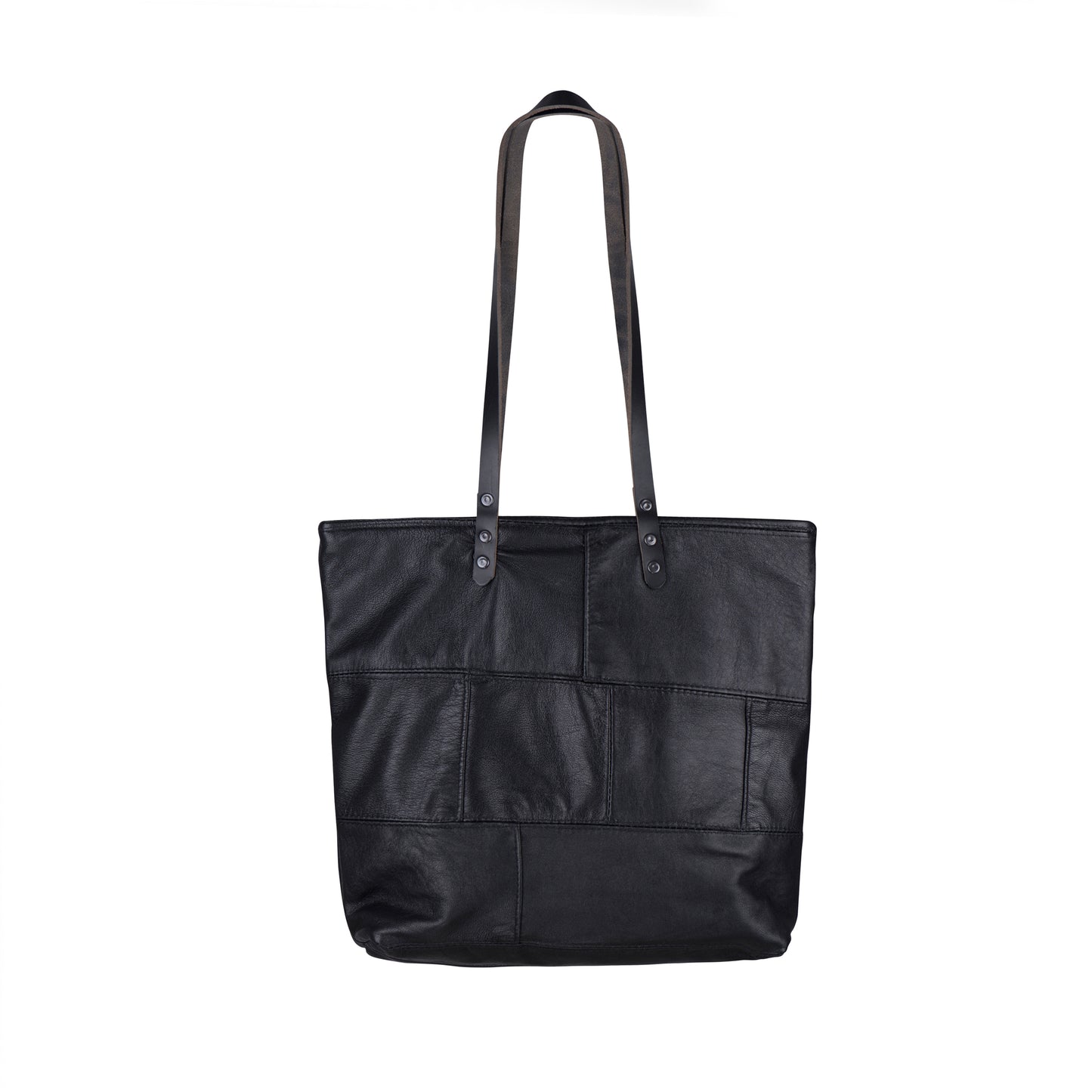 The back of the METANoIA The Cross Bag consisting of recycled leather with an original leather piece wherever possible, every bag has a unique pocket placement.