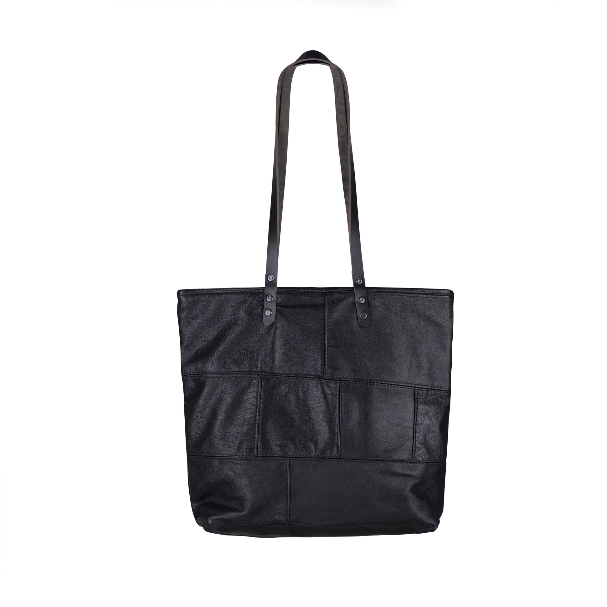 The back of the METANoIA The Cross Bag consisting of recycled leather with an original leather piece wherever possible, every bag has a unique pocket placement.