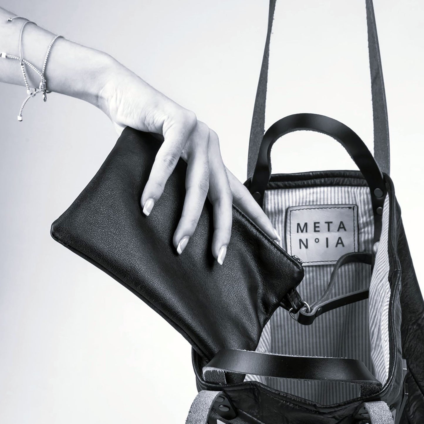 METANoIA The Disco Medium Bag inside featuring pinstripe fabric sourced from recycled fabric and a caramel leather woven label lasered with the iconic METANoIA label.