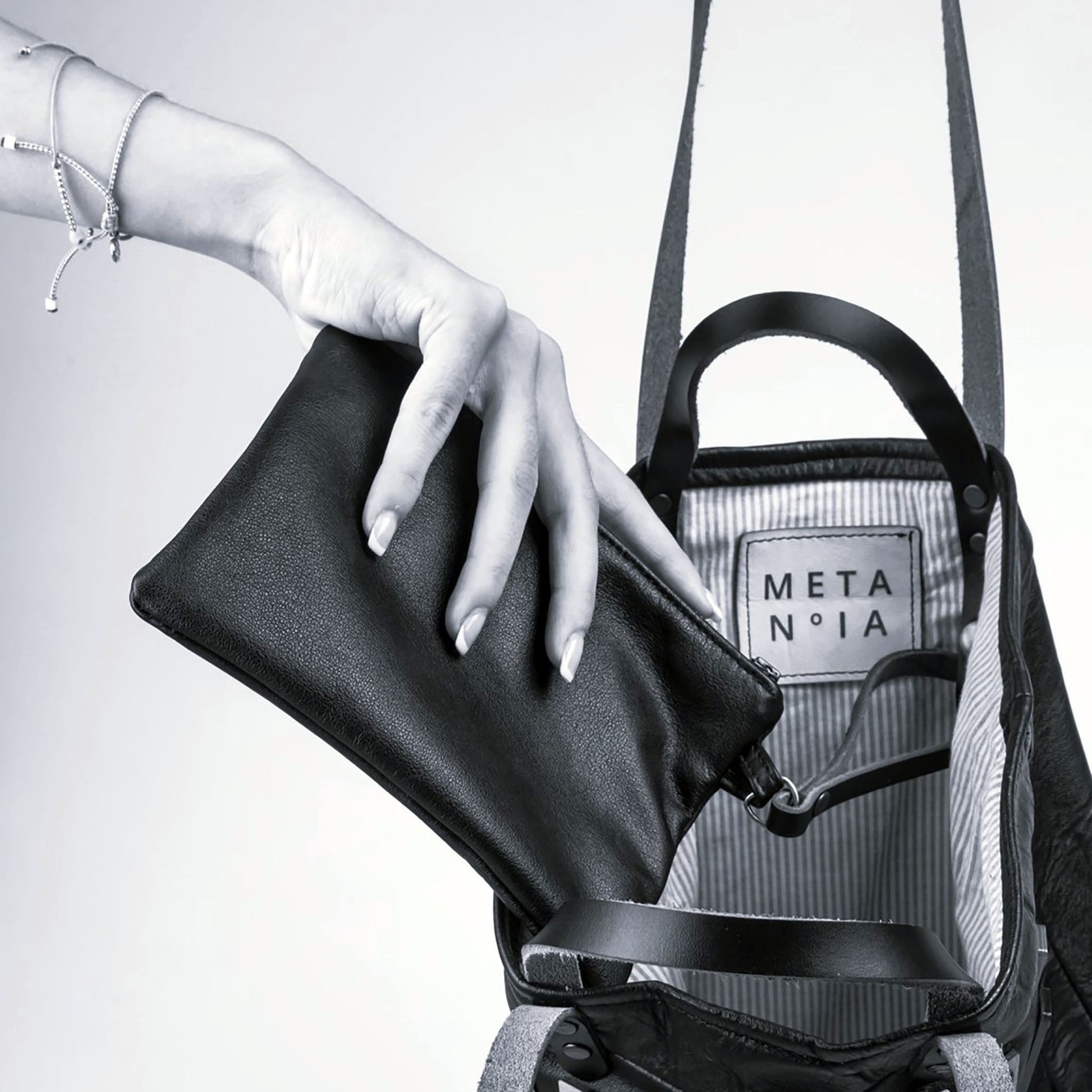 METANoIA The Disco Medium Bag inside featuring pinstripe fabric sourced from recycled fabric and a caramel leather woven label lasered with the iconic METANoIA label.