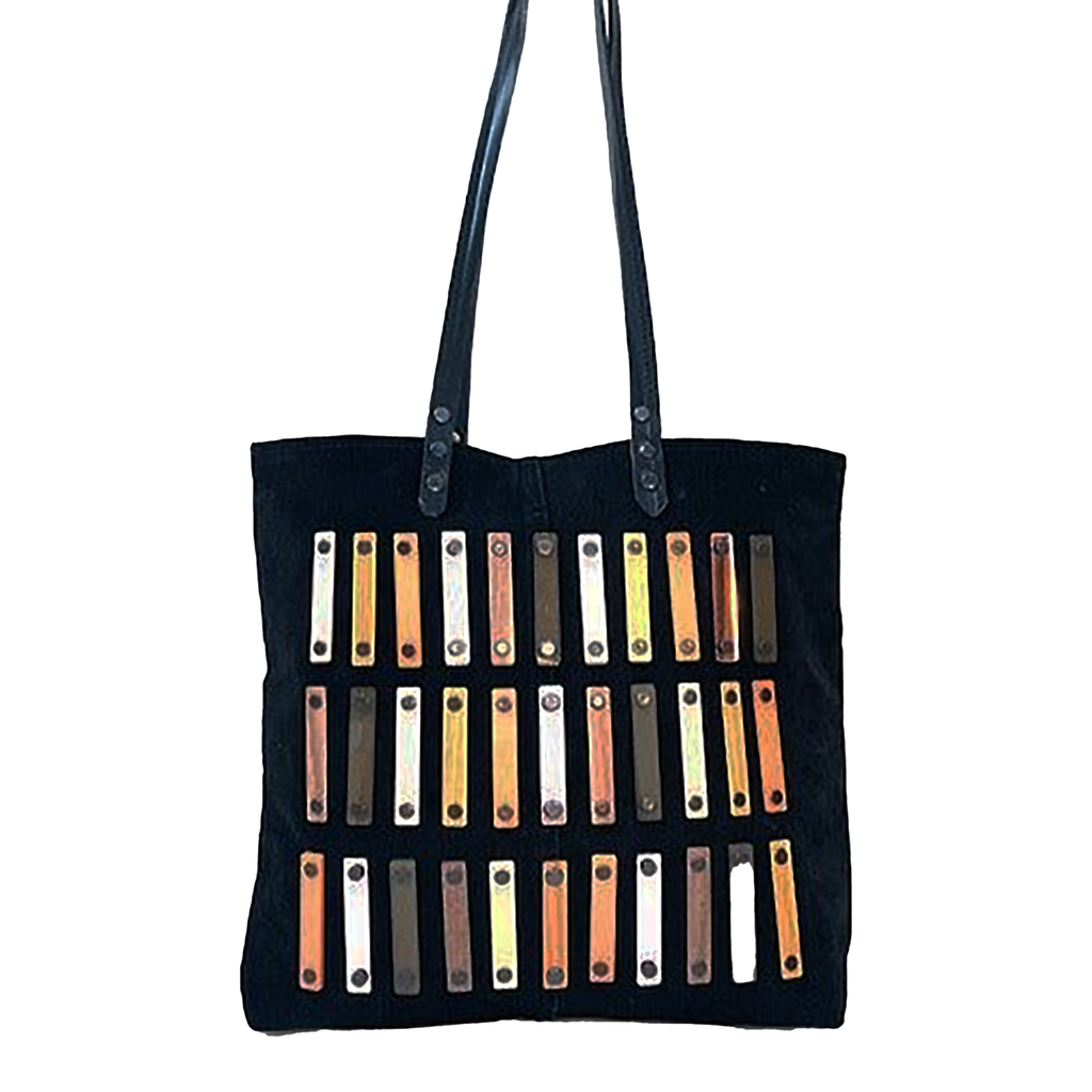 METANoIA black recycled leather medium handbag with acrylic and wooden vertical accents studded in a repeatitive fashion in an array of natural wooden browns, coppers and white. 